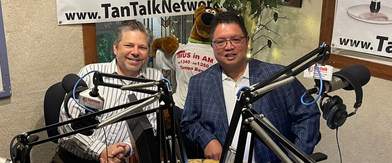 Lex Nepomuceno and DJ Northrop together at the broadcast desk in the Tan Talk Radio Network studio